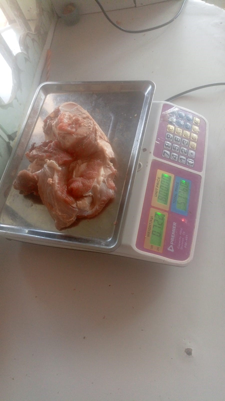Fresh meat on a weighing scale
